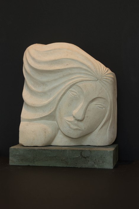 Sculpture of female head: carved in Portland stone